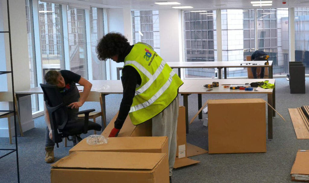 Andrews Office Furniture installers assembling commercial office furniture.