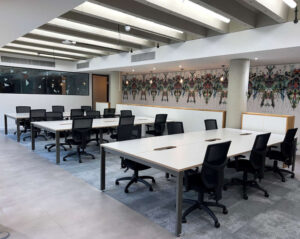 Modern office furnished with high-quality refurbished desks, storage and meeting furniture.