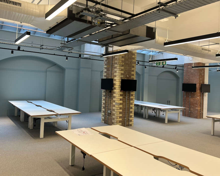 High-quality used commercial office desks installed in a modern workplace.